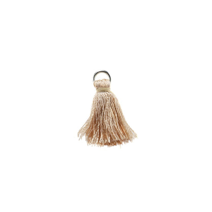 10 à 20 pendentifs à petits pompons en coton de 2 cm.